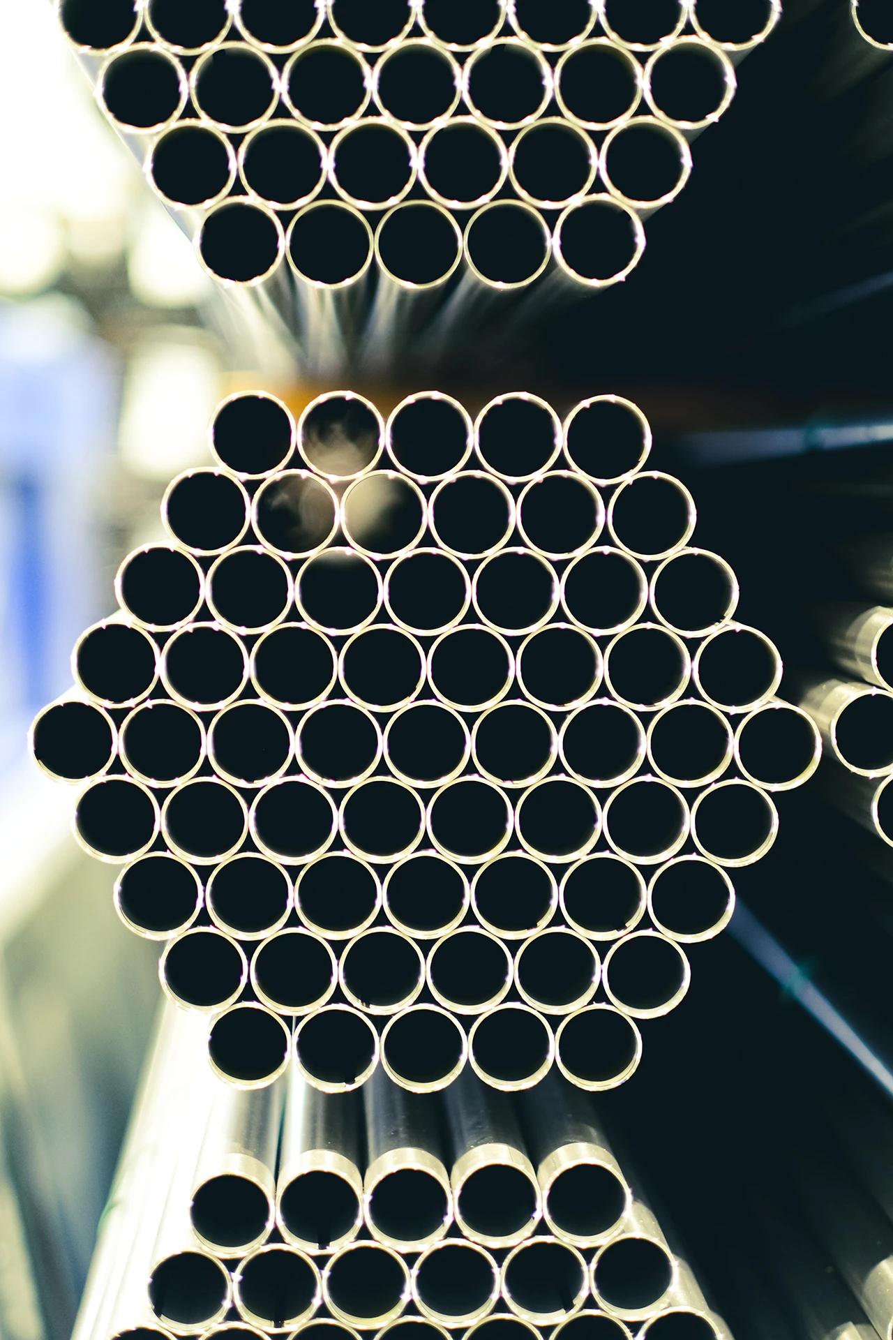 Closeup of metal pipes in storage racks